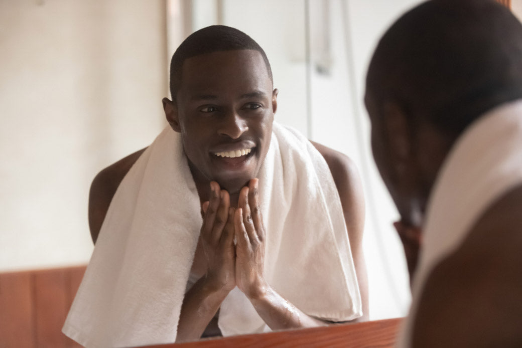 man with a towel on shoulders